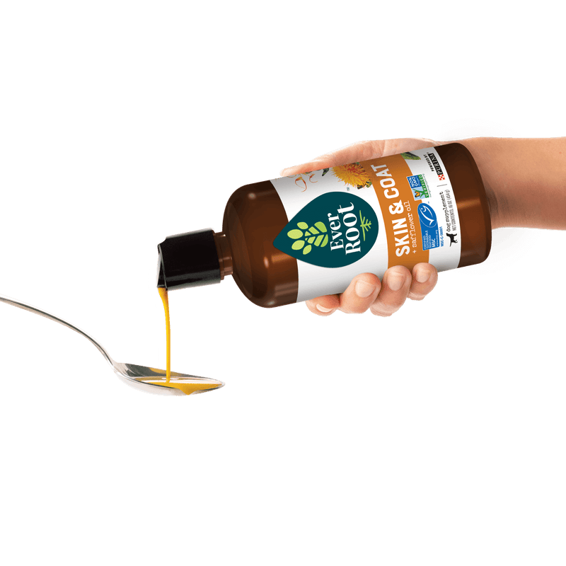 EverRoot Skin & Coat Safflower Oil Bottle poured onto spoon