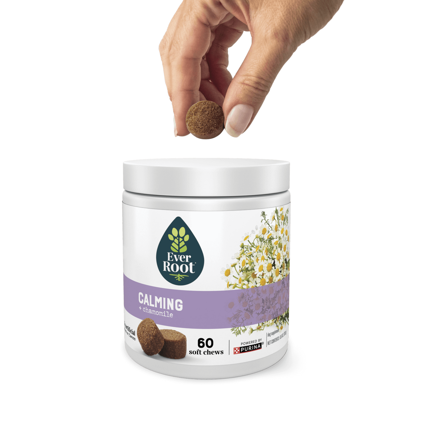 Hand holding a chew, hovering over a container of EverRoot Calming Soft Chews